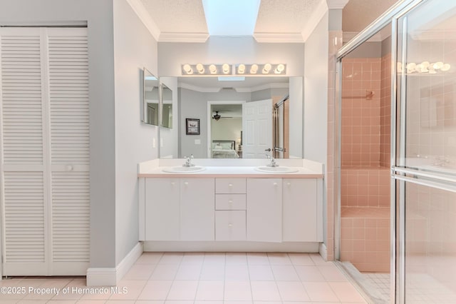 2481 Whispering Pines Ct, Spring Hill, FL 34606 - full bath with a closet, ornamental molding, ceiling fan, double vanity, and a stall shower