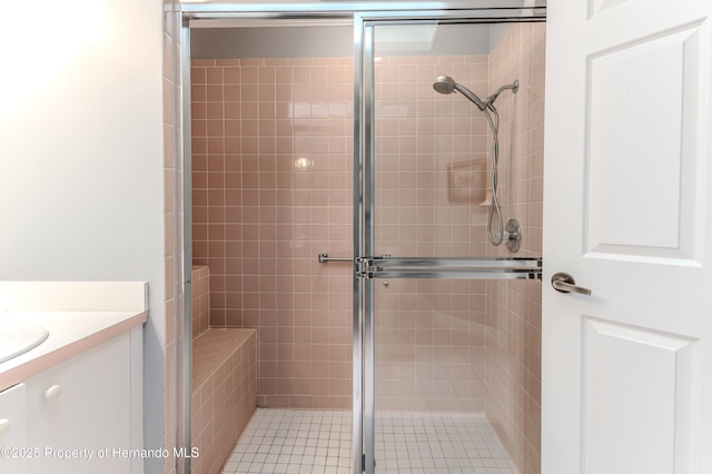 2481 Whispering Pines Ct, Spring Hill, FL 34606 - bathroom featuring a stall shower and vanity