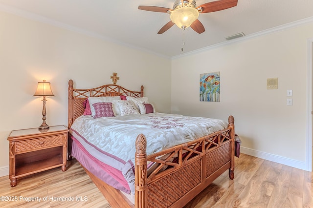 2481 Whispering Pines Ct, Spring Hill, FL 34606 - bedroom featuring light wood-type flooring, ornamental molding, baseboards, and a ceiling fan