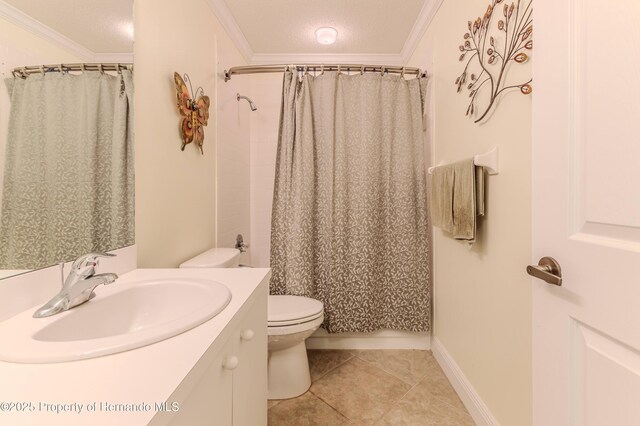 2481 Whispering Pines Ct, Spring Hill, FL 34606 - full bathroom with toilet, vanity, crown molding, tile patterned flooring, and a textured ceiling