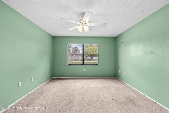 2450 Ambassador Ave, Spring Hill, FL 34609 - carpeted spare room featuring a ceiling fan, a textured ceiling, and baseboards