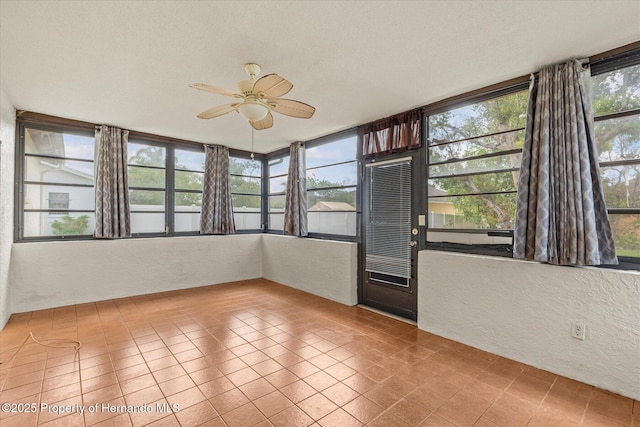 2450 Ambassador Ave, Spring Hill, FL 34609 - unfurnished sunroom with a textured wall