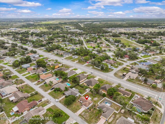 2450 Ambassador Ave, Spring Hill, FL 34609 - aerial view of property and surrounding area featuring nearby suburban area