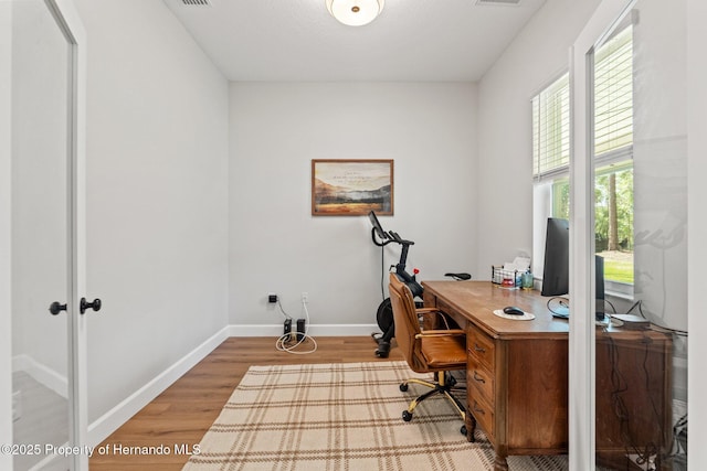 27295 Tarbel Rd, Brooksville, FL 34602 - office area featuring wood finished floors and baseboards