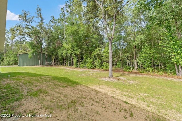 27295 Tarbel Rd, Brooksville, FL 34602 - view of green lawn featuring an outbuilding
