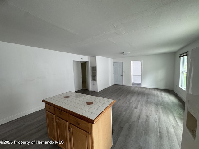 221 Highland St, Brooksville, FL 34601 - unfurnished living room with baseboards and dark wood-style flooring