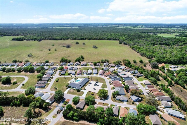 10485 S Drew Bryant Cir, Floral City, FL 34436 - aerial view of property and surrounding area with a forest and nearby suburban area