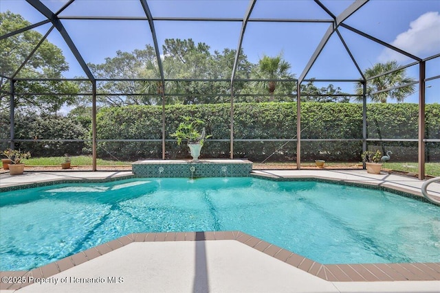 9406 Burnam Dr, Weeki Wachee, FL 34613 - swimming pool featuring glass enclosure and a patio