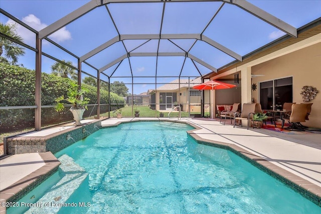 9406 Burnam Dr, Weeki Wachee, FL 34613 - outdoor pool featuring a patio area and a ceiling fan