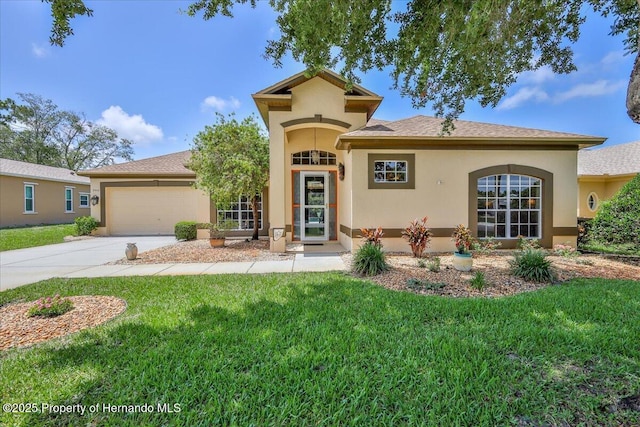 9406 Burnam Dr, Weeki Wachee, FL 34613 - view of front of property with stucco siding, concrete driveway, an attached garage, and a front lawn