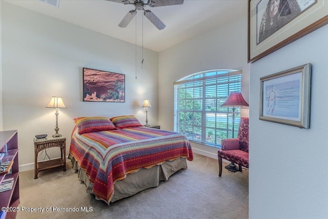 9406 Burnam Dr, Weeki Wachee, FL 34613 - bedroom with carpet, baseboards, and ceiling fan