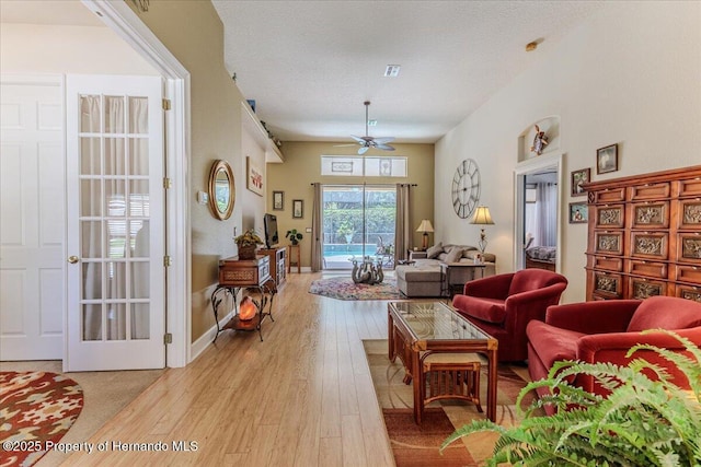 9406 Burnam Dr, Weeki Wachee, FL 34613 - living area with a ceiling fan and light wood-type flooring