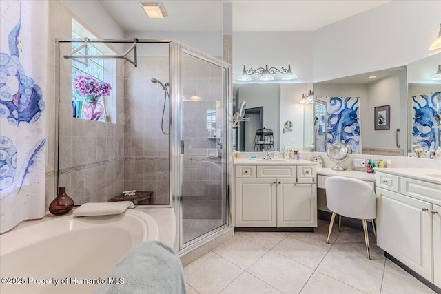 9406 Burnam Dr, Weeki Wachee, FL 34613 - bathroom featuring double vanity, a stall shower, tile patterned floors, and a bath