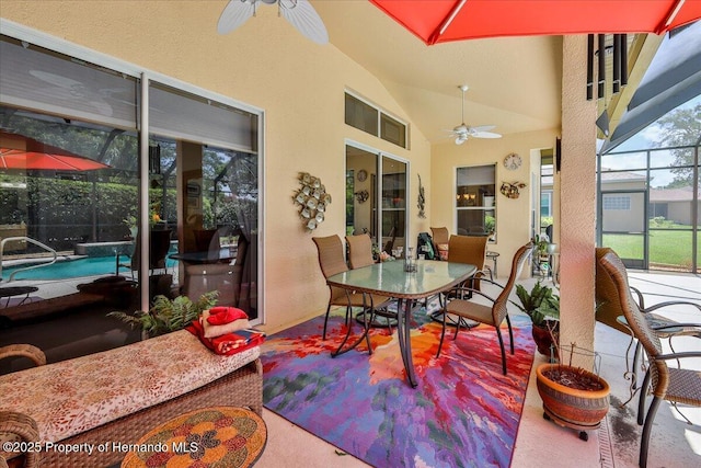 9406 Burnam Dr, Weeki Wachee, FL 34613 - sunroom with ceiling fan, outdoor dining area, and lofted ceiling