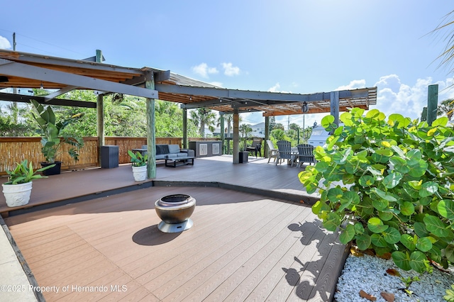 4566 Gulfstream Dr, Hernando Beach, FL 34607 - wooden terrace featuring an outdoor living space