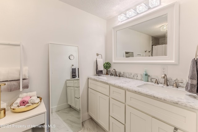 4566 Gulfstream Dr, Hernando Beach, FL 34607 - full bathroom with double vanity, a textured ceiling, and marble finish floors