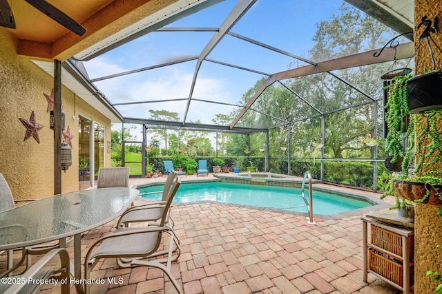 11422 Warm Wind Way, Weeki Wachee, FL 34613 - view of pool with a patio area, a lanai, and a pool with connected hot tub