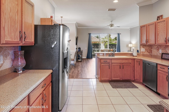 22316 Red Jacket, Land O Lakes, FL 34639 - kitchen featuring appliances with stainless steel finishes, ornamental molding, light countertops, a sink, and a peninsula