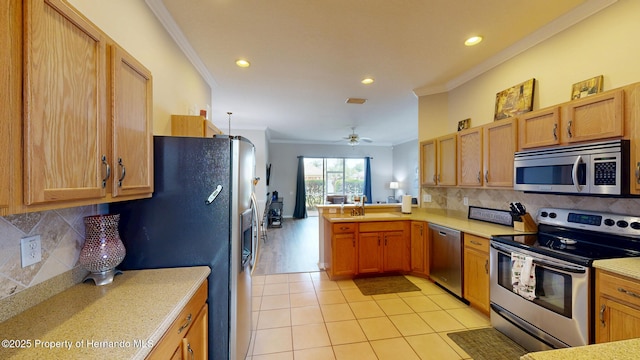 22316 Red Jacket, Land O Lakes, FL 34639 - kitchen with stainless steel appliances, ornamental molding, light countertops, recessed lighting, and a peninsula