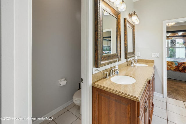 22316 Red Jacket, Land O Lakes, FL 34639 - full bathroom featuring tile patterned flooring, double vanity, toilet, and ensuite bathroom
