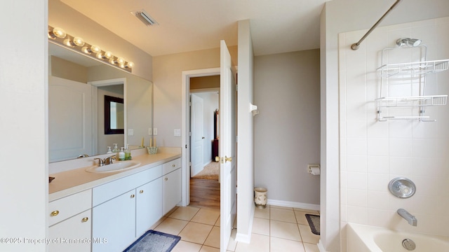 22316 Red Jacket, Land O Lakes, FL 34639 - full bathroom with vanity, tile patterned flooring, shower / bath combination, and baseboards