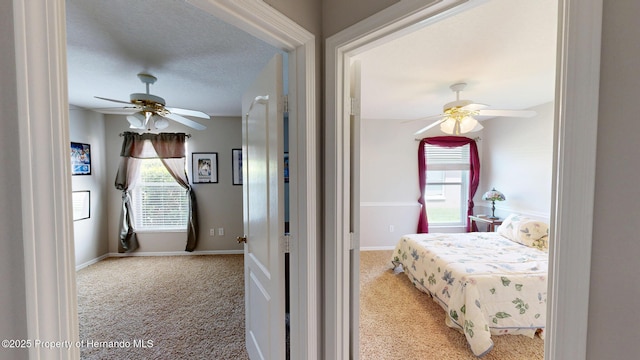 22316 Red Jacket, Land O Lakes, FL 34639 - bedroom with light carpet, ceiling fan, and baseboards
