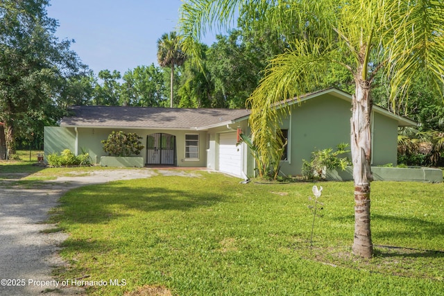 9766 W Smokey Ln, Crystal River, FL 34429 - single story home featuring dirt driveway, a garage, stucco siding, and a front yard