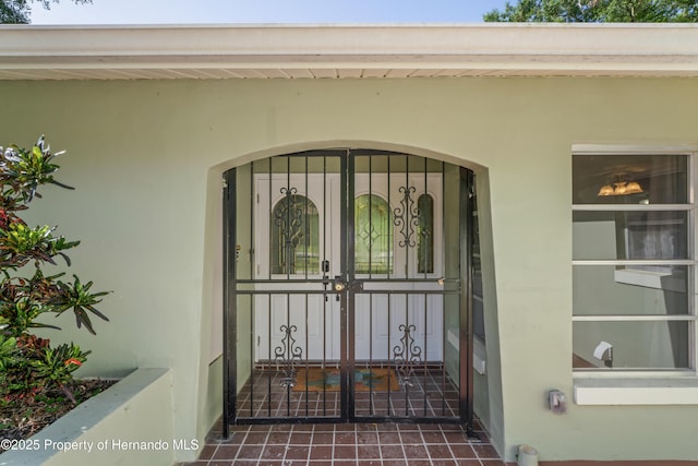 9766 W Smokey Ln, Crystal River, FL 34429 - doorway to property with stucco siding