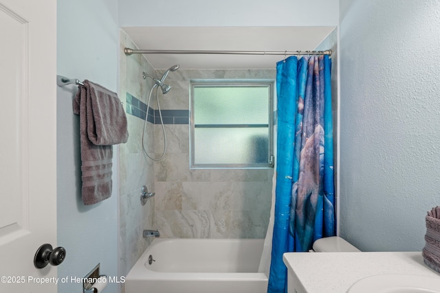 9766 W Smokey Ln, Crystal River, FL 34429 - bathroom featuring shower / bath combo with shower curtain, vanity, and toilet