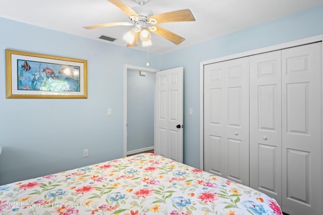 9766 W Smokey Ln, Crystal River, FL 34429 - bedroom with a closet and a ceiling fan