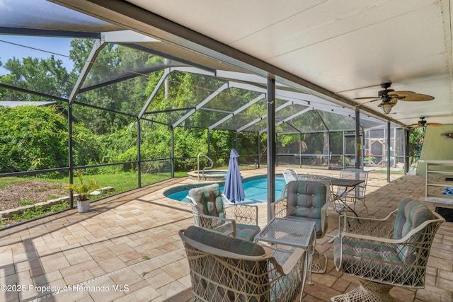 9766 W Smokey Ln, Crystal River, FL 34429 - view of pool featuring a patio, ceiling fan, glass enclosure, and a pool with connected hot tub