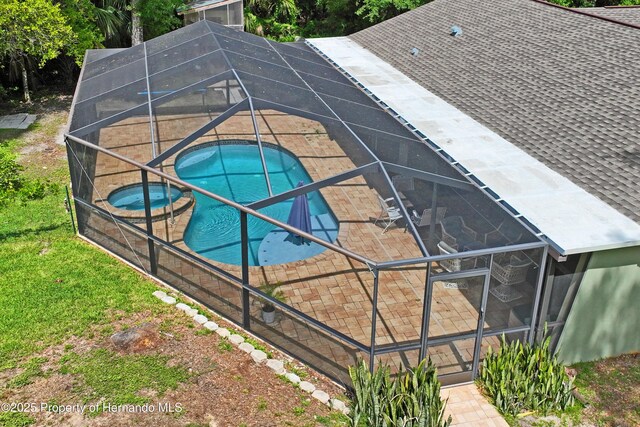 9766 W Smokey Ln, Crystal River, FL 34429 - swimming pool with a patio area, a lanai, and an in-ground hot tub