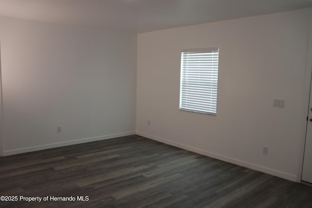 2001 W Royal Palm Dr, Dunnellon, FL 34434 - spare room with dark wood finished floors and baseboards