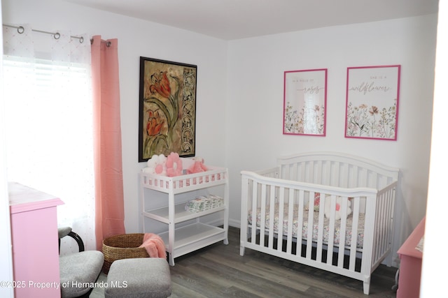 2001 W Royal Palm Dr, Dunnellon, FL 34434 - bedroom featuring wood finished floors and a nursery area