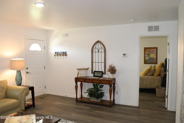 2001 W Royal Palm Dr, Dunnellon, FL 34434 - entryway with dark wood-style flooring and baseboards