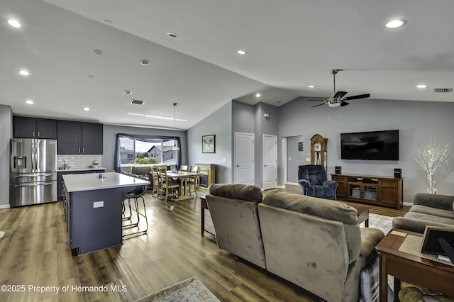 4123 Daisy Dr, Hernando Beach, FL 34607 - living room with vaulted ceiling, ceiling fan, wood finished floors, and recessed lighting