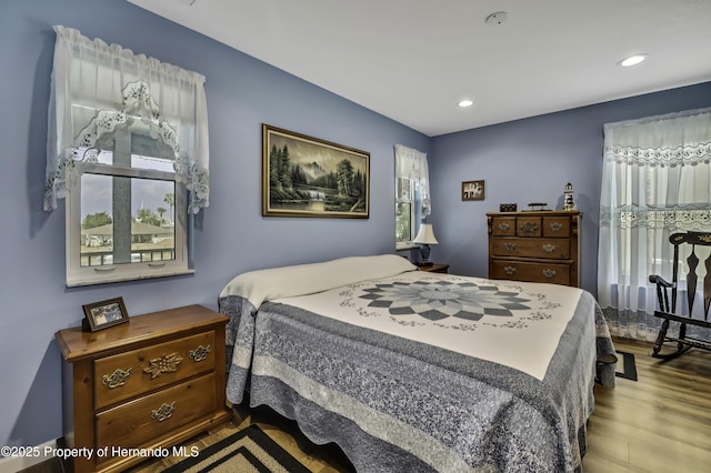 4123 Daisy Dr, Hernando Beach, FL 34607 - bedroom featuring wood finished floors and recessed lighting