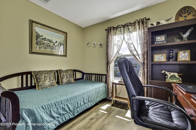 4123 Daisy Dr, Hernando Beach, FL 34607 - bedroom with wood finished floors and an office area