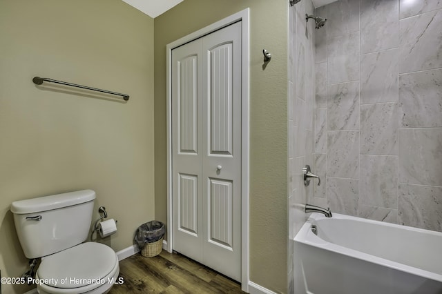 4123 Daisy Dr, Hernando Beach, FL 34607 - bathroom featuring toilet, wood finished floors, shower / bath combination, baseboards, and a closet