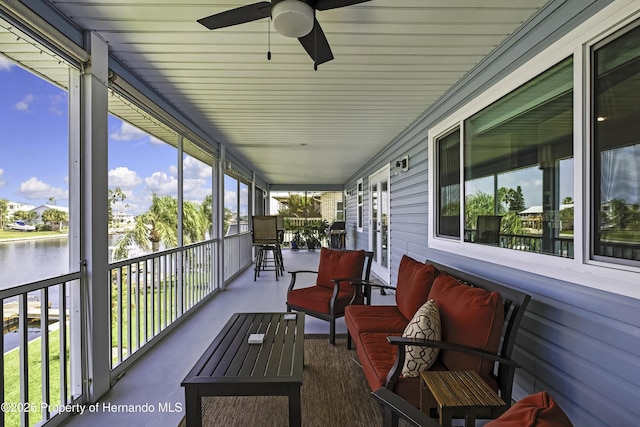 4123 Daisy Dr, Hernando Beach, FL 34607 - sunroom with a ceiling fan and a water view