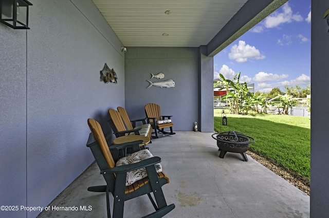 4123 Daisy Dr, Hernando Beach, FL 34607 - view of patio / terrace featuring an outdoor fire pit