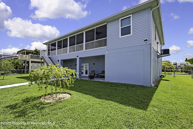 4123 Daisy Dr, Hernando Beach, FL 34607 - rear view of property with a sunroom, a patio area, and stairs