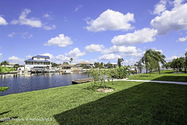 4123 Daisy Dr, Hernando Beach, FL 34607 - dock area featuring a lawn and a water view