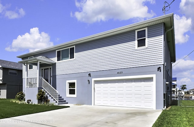 4123 Daisy Dr, Hernando Beach, FL 34607 - view of front of house featuring a garage and driveway