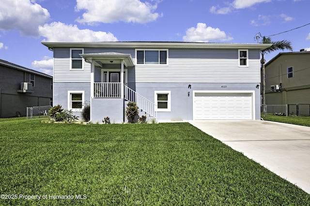4123 Daisy Dr, Hernando Beach, FL 34607 - view of front of home with an attached garage, driveway, and stucco siding