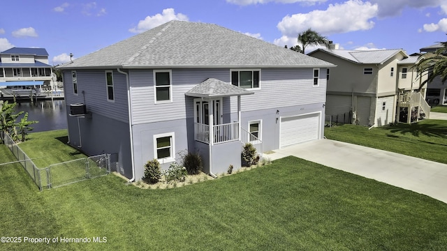 4123 Daisy Dr, Hernando Beach, FL 34607 - view of front of property featuring roof with shingles, a garage, driveway, and a water view