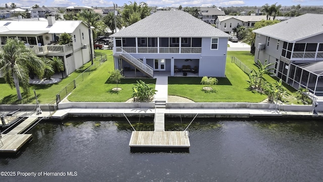 4123 Daisy Dr, Hernando Beach, FL 34607 - rear view of house featuring a water view, a sunroom, a residential view, and a patio area