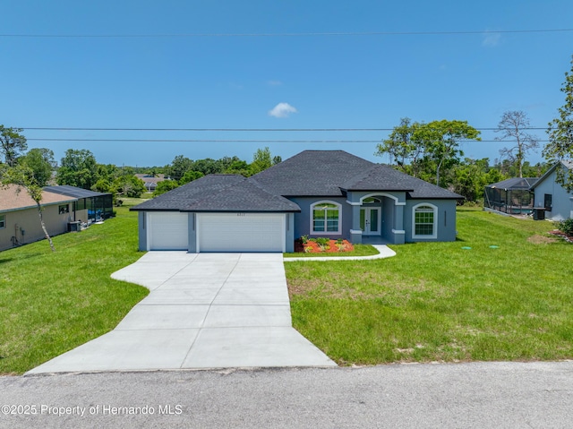 5317 Lydia Ct, Spring Hill, FL 34608 - french country inspired facade with concrete driveway, a front lawn, stucco siding, and a garage