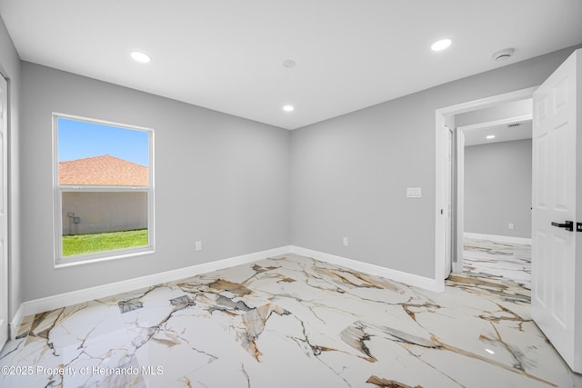 5317 Lydia Ct, Spring Hill, FL 34608 - spare room with light marble finish floors, recessed lighting, baseboards, and a smoke detector