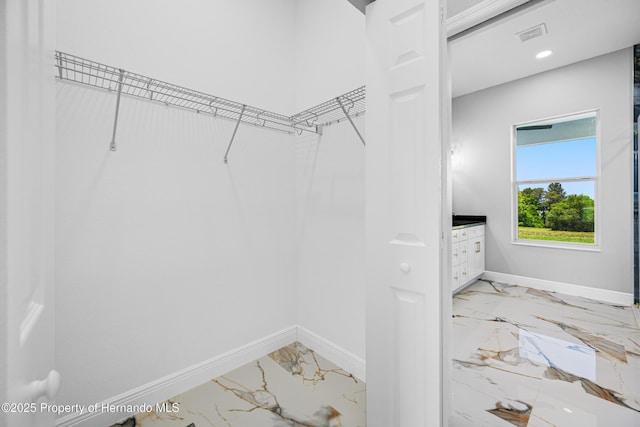 5317 Lydia Ct, Spring Hill, FL 34608 - spacious closet featuring marble tiled flooring